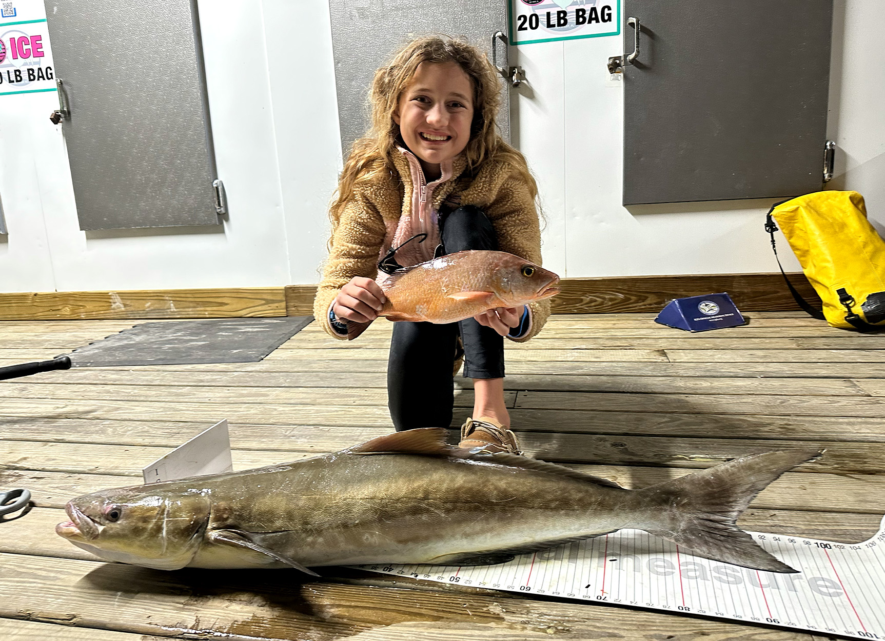 A youth angler in Flordia with two state-record fish.